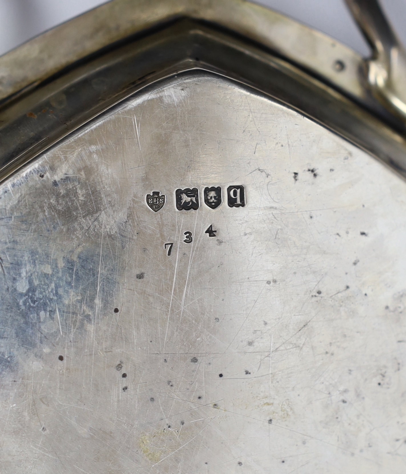 A George V silver elliptical two handled tea tray, Edward Barnard & Sons, London, 1911, 62.6cm over handles
